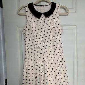 Cream and black bow tie patterned collared dress